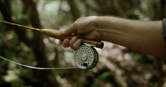 How does the action of a bamboo fly rod compare to graphite?