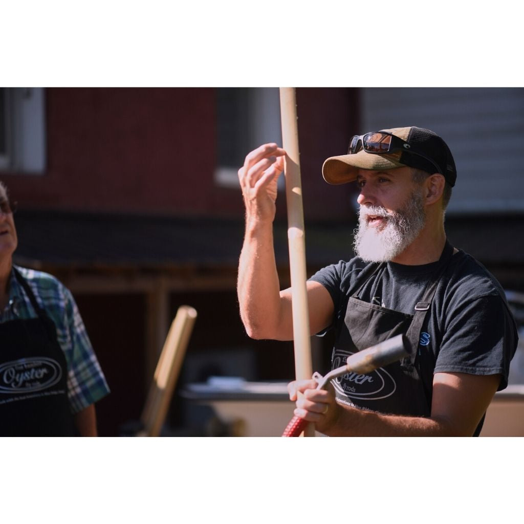 Bill Oyster instructing how to flame oyster bamboo fly rod