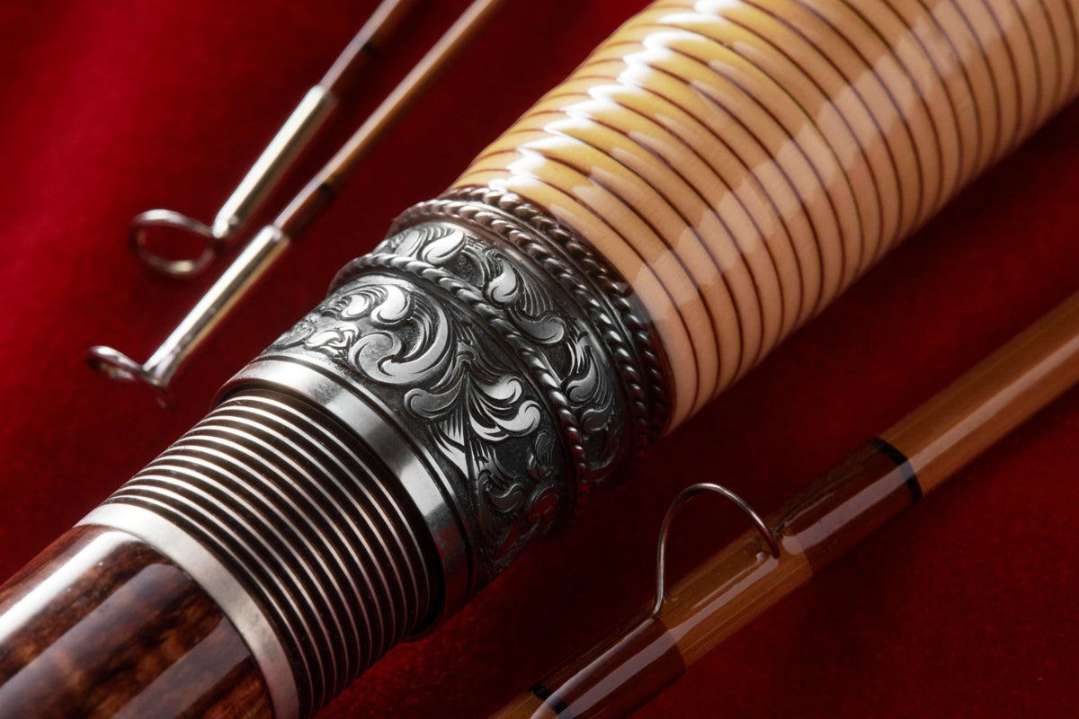 Hand engraved scroll and rattan grip on 7'6" 3wt bamboo fly rod.