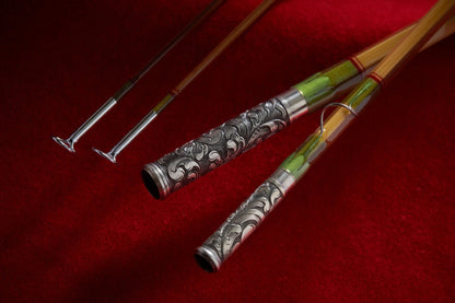 Hand engraved scroll work on nickel silver ferrules for bamboo fly rod. 