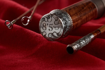 8' 5wt bamboo fly rod with hand engraved butt cap and ferrules.