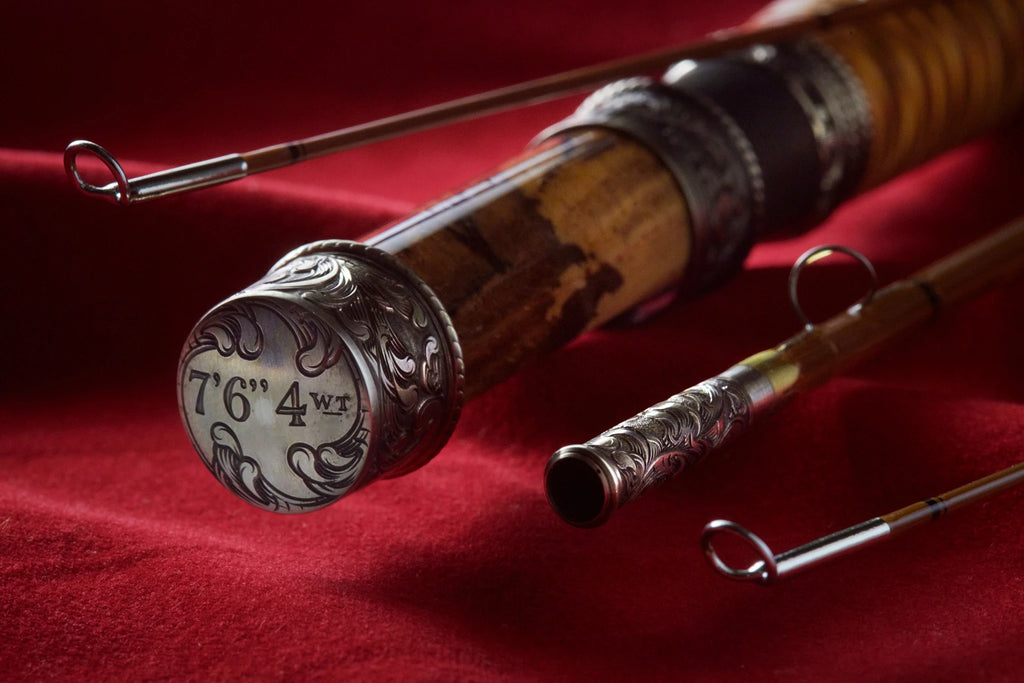 7'6" 4wt bamboo fly rod with hand engraved scroll on butt cap and ferrules.