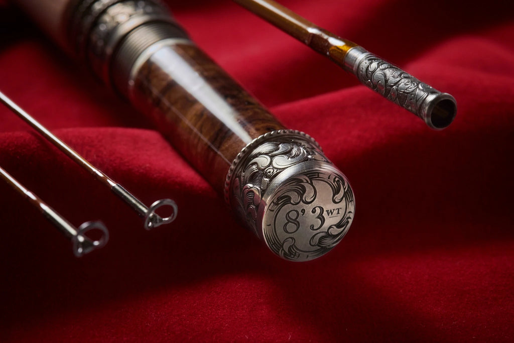 8' 3wt bamboo fly rod with hand engraved scroll on butt cap, reel seat, and ferrule.