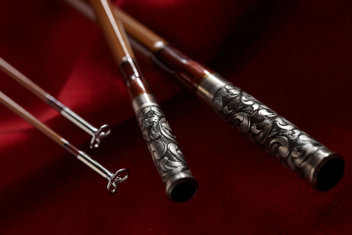 8' 6wt bamboo fly rod with hand engraved scroll on nickel silver ferrules.