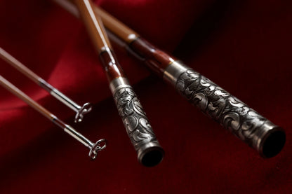 8' 6wt bamboo fly rod with hand engraved scroll on nickel silver ferrules.