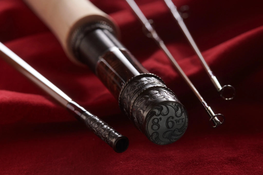 8' 6wt bamboo fly rod with hand engraved scroll nickel silver butt cap, rod seat, and ferrule.