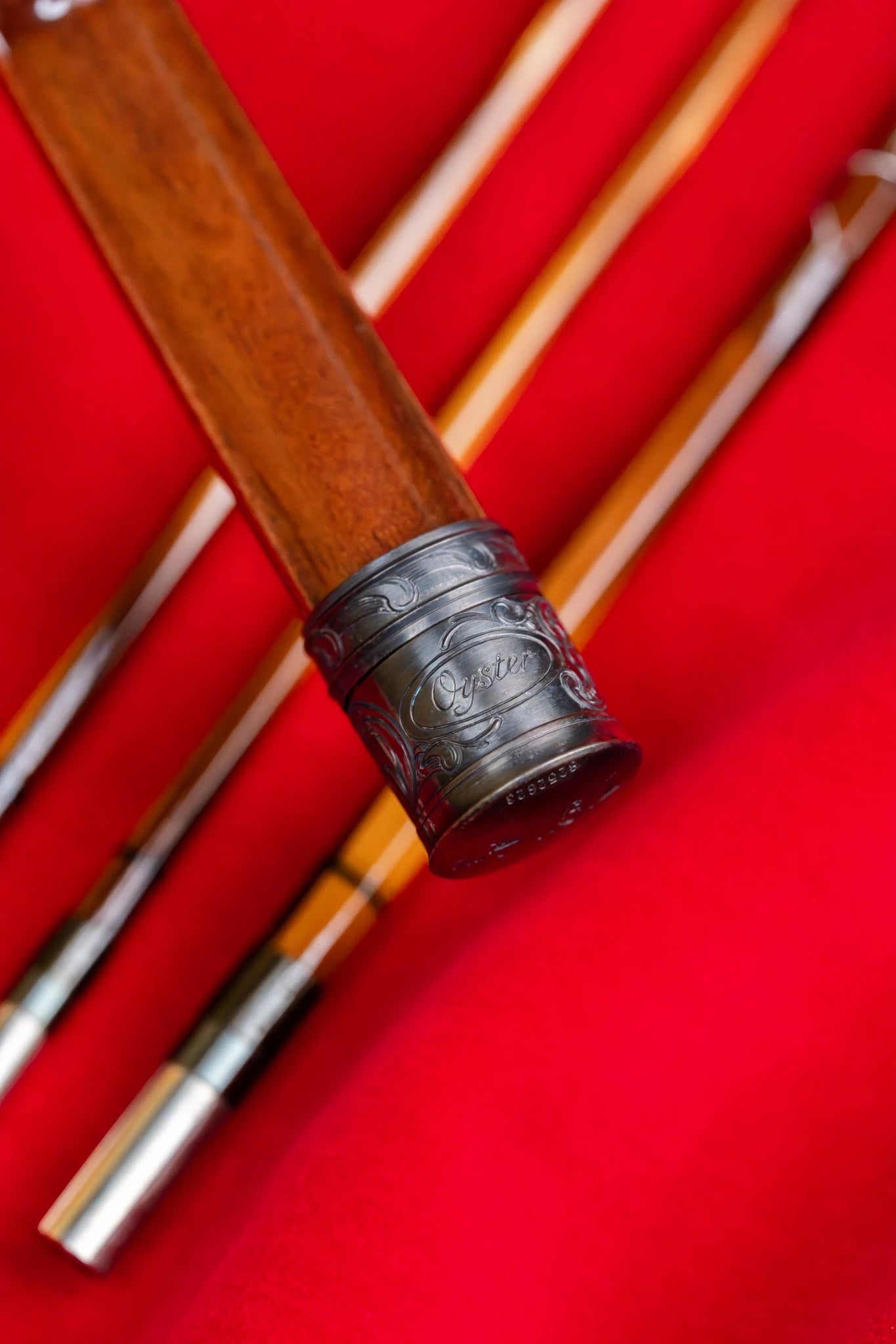7'9" 4wt bamboo fly rod with hand engraved scroll on blued butt cap and reel seat.