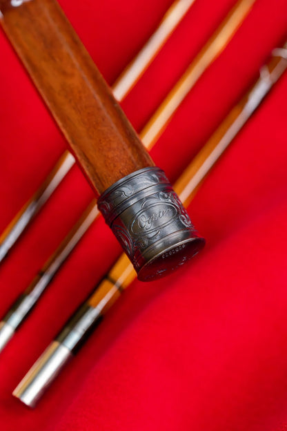 7'9" 4wt bamboo fly rod with hand engraved scroll on blued butt cap and reel seat.