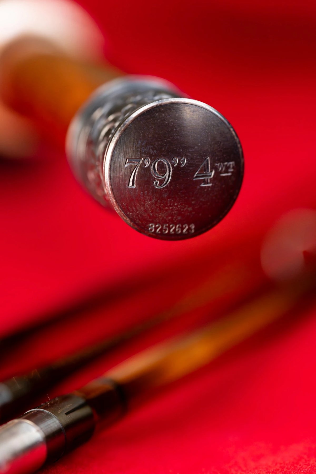 7'9" 4wt handcrafted bamboo fly rod with hand engraved butt cap.