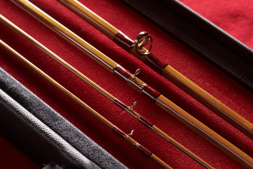 Close up shot of agate guides on a bamboo fly rod. 