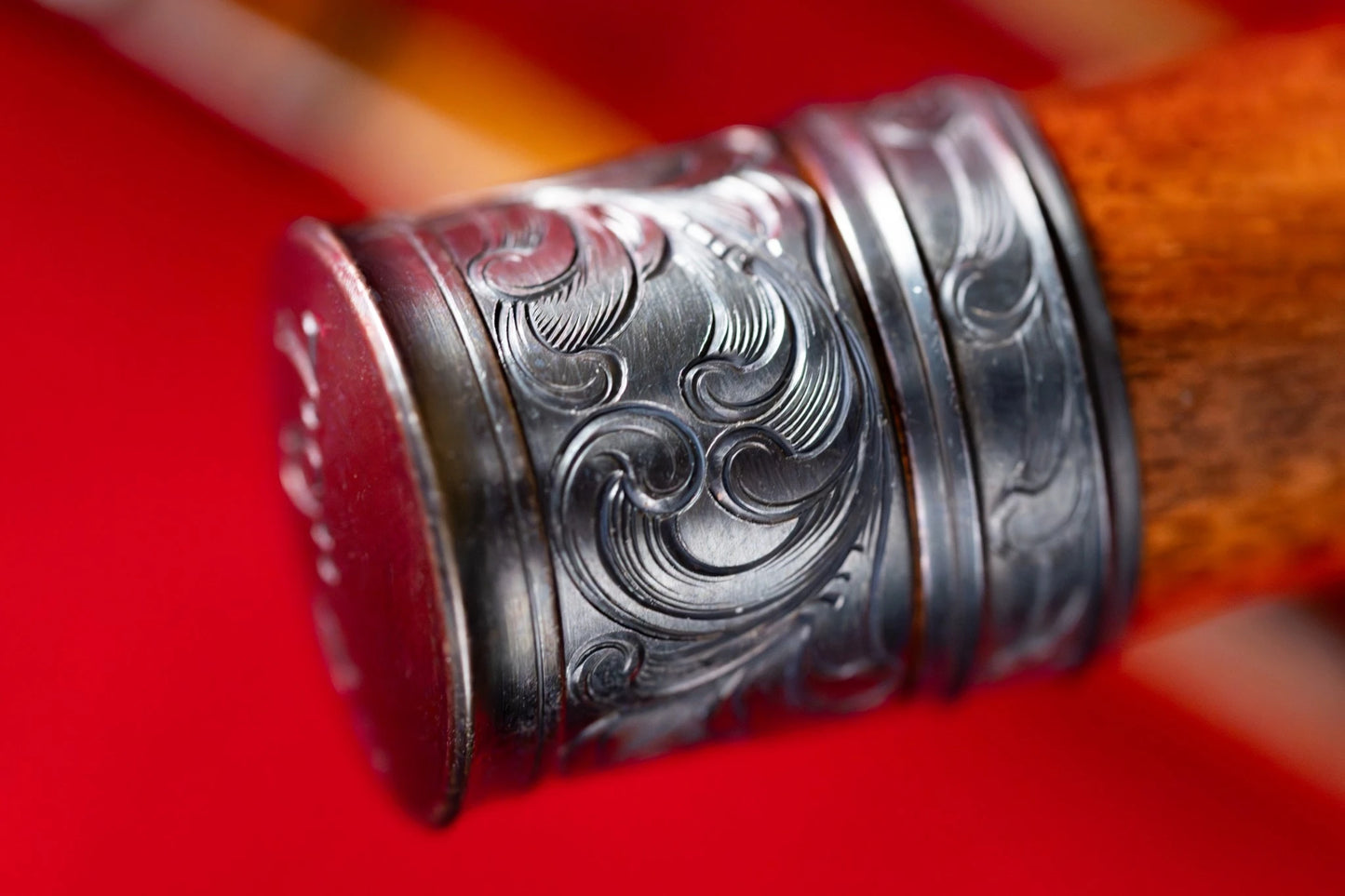 Hand engraved scroll on reel seat of 7'9" 4wt bamboo fly rod.