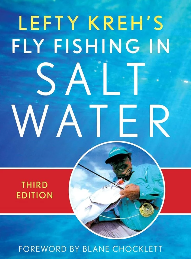 Print cover of Lefty Kreh's Fly Fishing in Salt Water with foreword by Blane Chocklett featuring a photo of a man holding up a caught fish. 