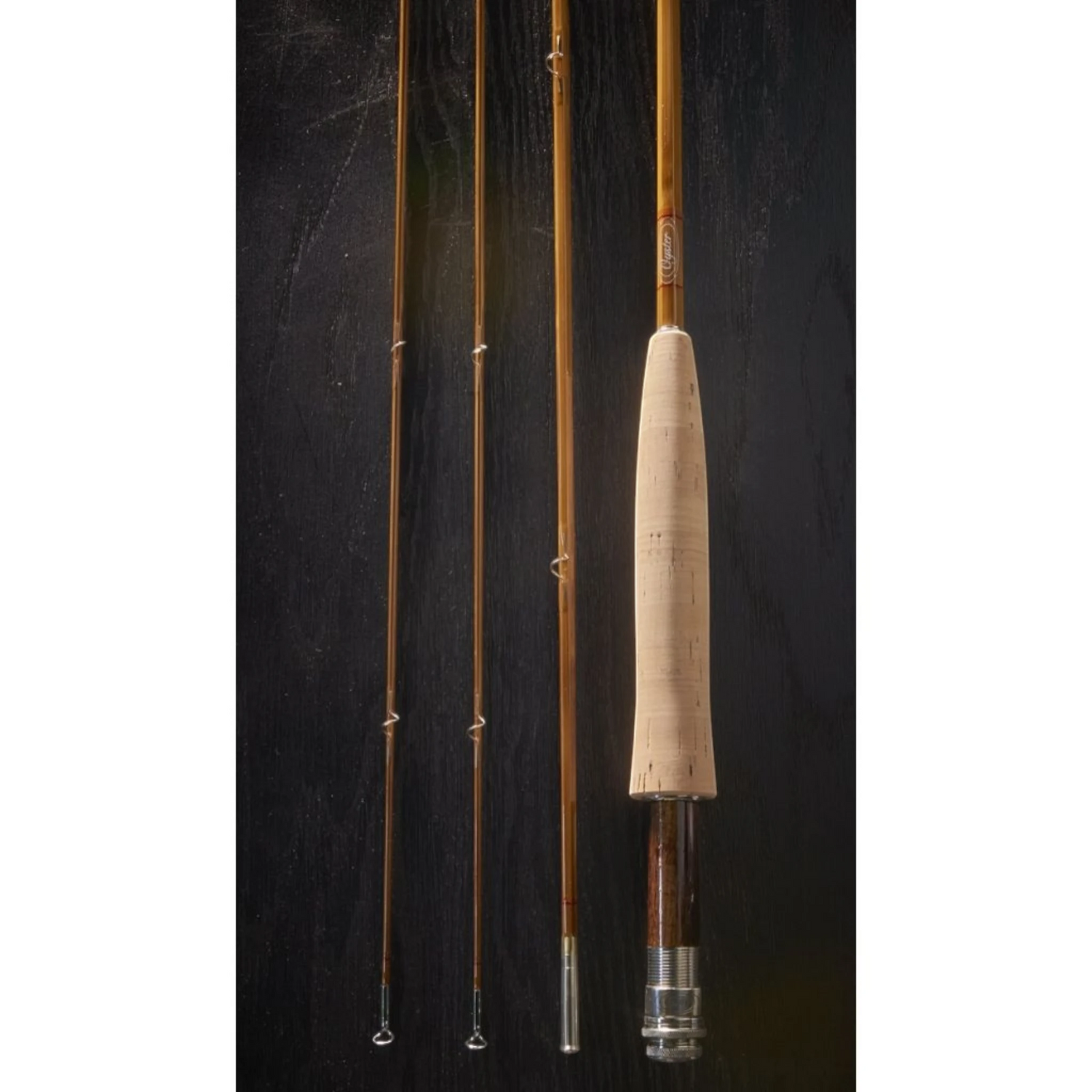7'9" 5wt bamboo fly rod with silver butt cap and cork handle from Oyster Bamboo. 
