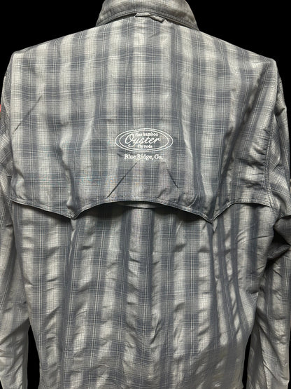 Simms Big Sky long sleeve shirt in black plaid featuring Oyster fly rods logo.