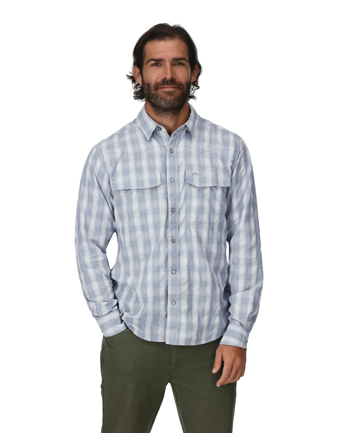 A man wearing Simms Big Sky long sleeve fishing shirt in bimini blue plaid.